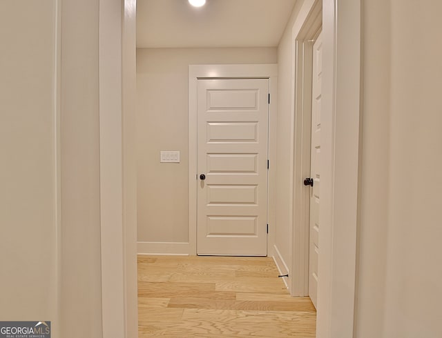 hall with light hardwood / wood-style floors