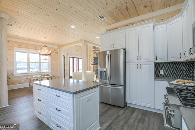 kitchen with wood ceiling, white cabinetry, appliances with stainless steel finishes, a center island, and dark wood finished floors