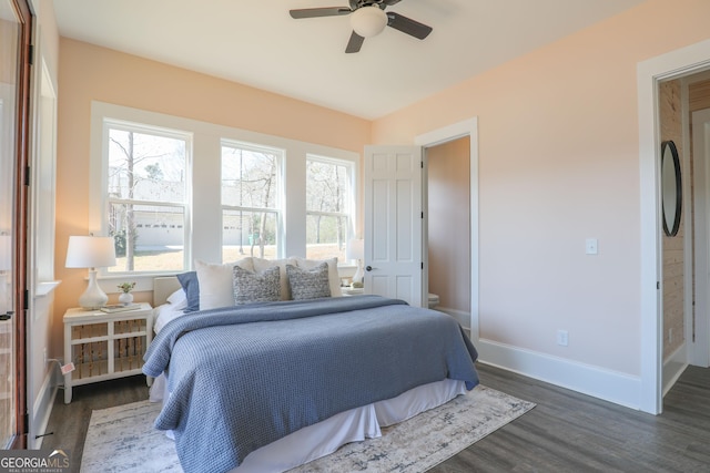 bedroom featuring wood finished floors, a ceiling fan, and baseboards