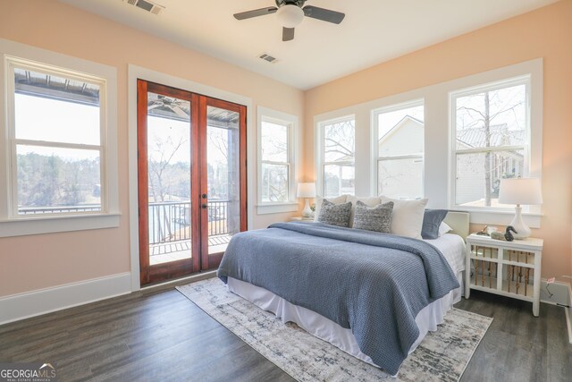 interior space featuring a wealth of natural light, dark wood-type flooring, and ceiling fan