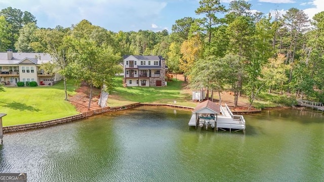 dock area with a yard and a water view