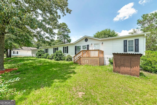 exterior space featuring a wooden deck and a front yard