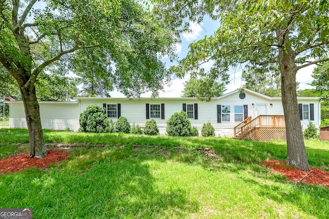 ranch-style house featuring a front yard