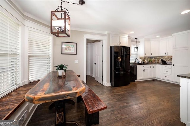 dining room with dark wood finished floors, crown molding, recessed lighting, and baseboards