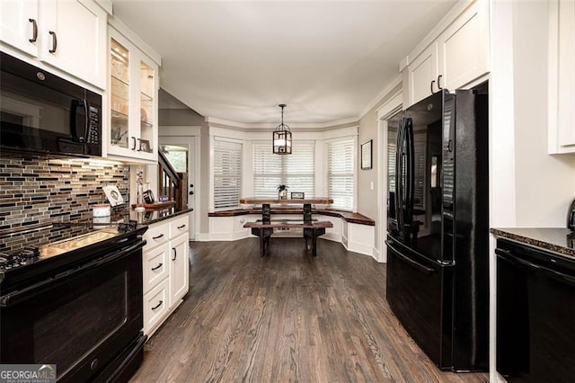 kitchen featuring tasteful backsplash, black appliances, glass insert cabinets, white cabinetry, and dark wood-style flooring