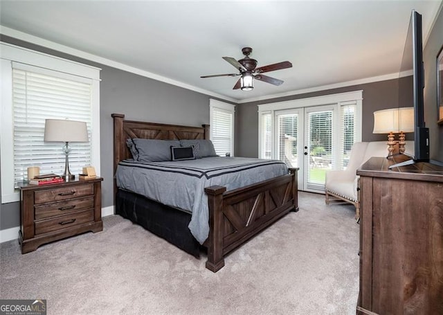 carpeted bedroom with ceiling fan, ornamental molding, and access to exterior