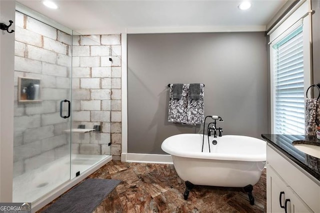 bathroom with tile patterned flooring, separate shower and tub, and vanity