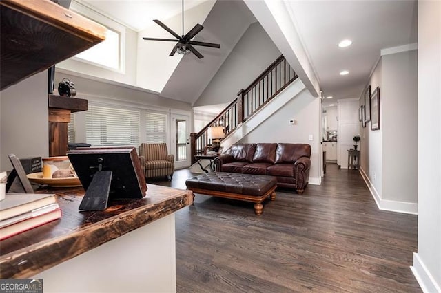 living room with ceiling fan, high vaulted ceiling, and dark wood-type flooring