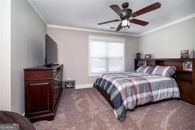 carpeted bedroom with ceiling fan and ornamental molding