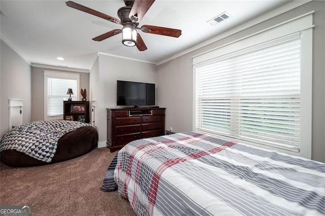 bedroom with visible vents, a ceiling fan, ornamental molding, and carpet flooring