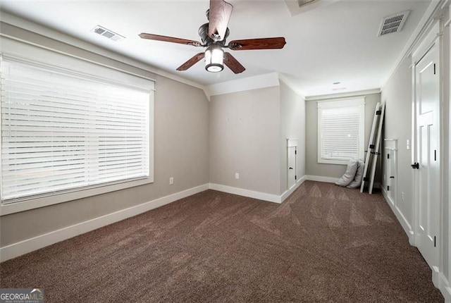 unfurnished room with ceiling fan, ornamental molding, and carpet flooring