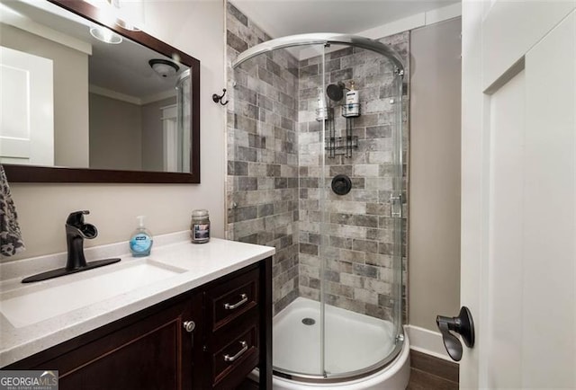 full bath featuring a stall shower and vanity