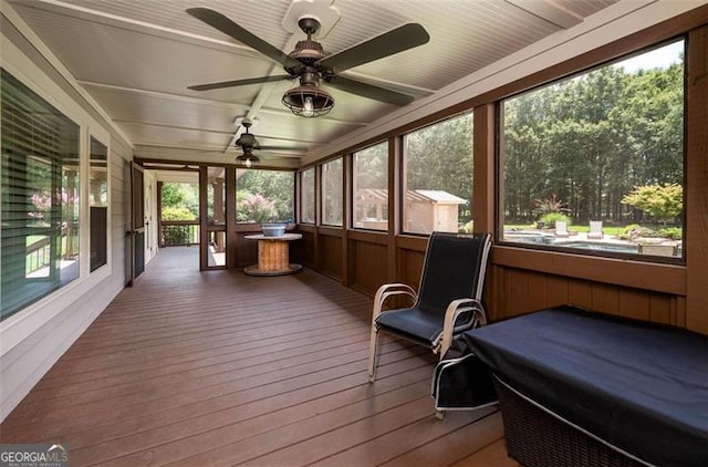 sunroom / solarium with ceiling fan