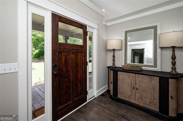 foyer entrance featuring dark wood-style floors and baseboards