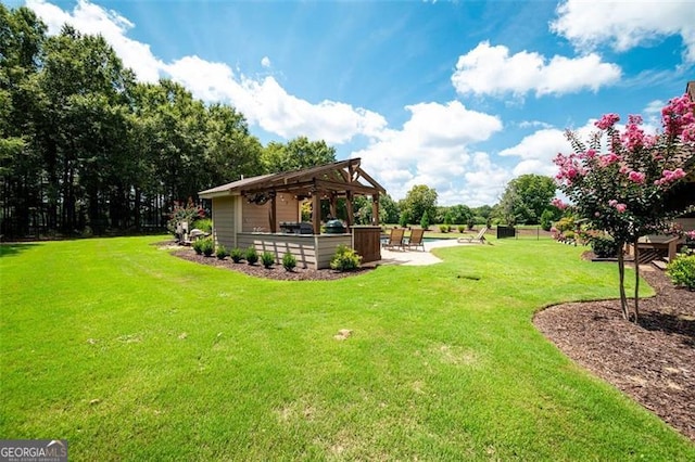 view of yard featuring a pergola and a patio