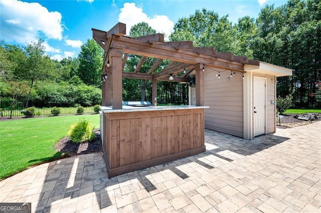 view of patio featuring a pergola and fence