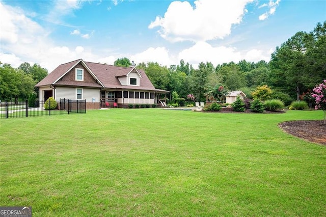 view of yard featuring fence and a sunroom