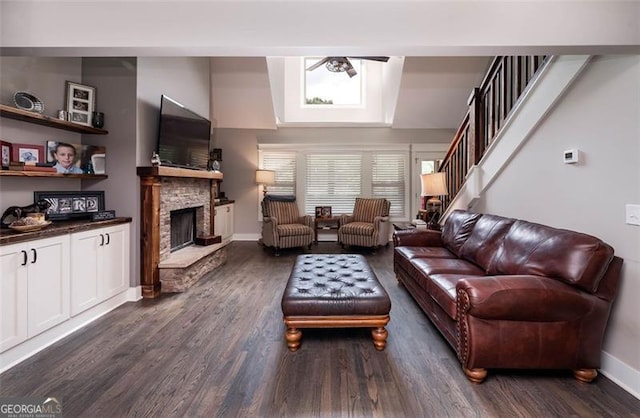 living room featuring a fireplace and dark hardwood / wood-style flooring