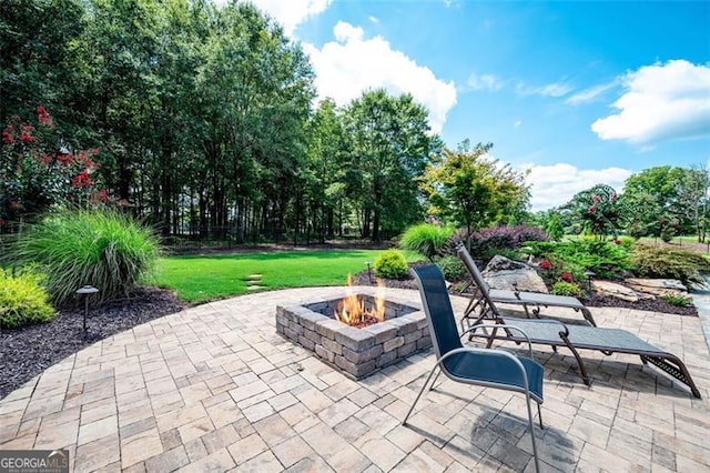 view of patio / terrace featuring a fire pit