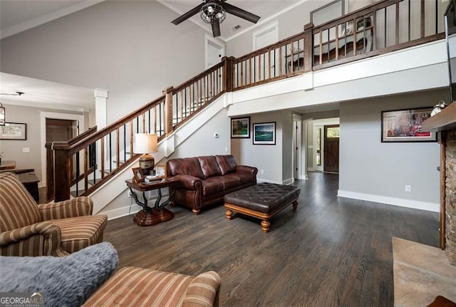 living room with ceiling fan, hardwood / wood-style flooring, ornamental molding, and high vaulted ceiling