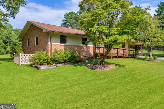 view of yard with a wooden deck