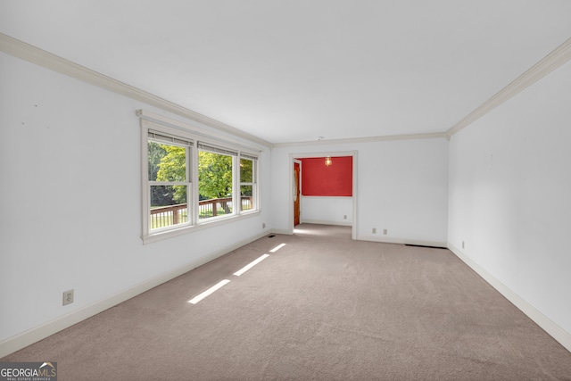 unfurnished room featuring carpet flooring and ornamental molding