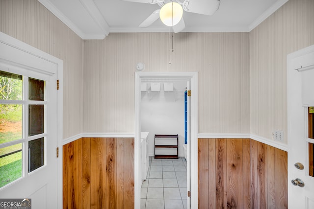 kitchen with crown molding, light tile patterned floors, and ceiling fan