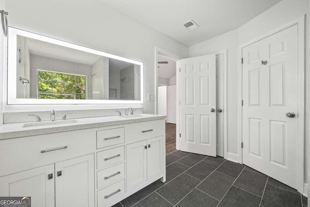 bathroom featuring double sink vanity and tile patterned floors