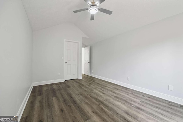 unfurnished bedroom with ceiling fan, vaulted ceiling, and wood-type flooring