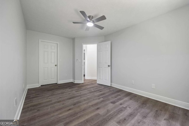 unfurnished bedroom featuring ceiling fan and hardwood / wood-style flooring