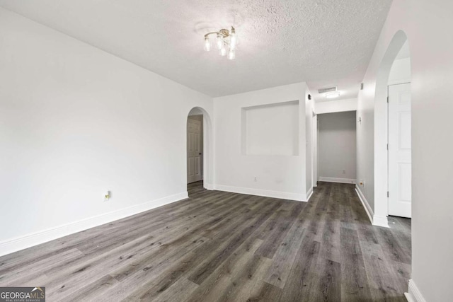 interior space featuring hardwood / wood-style flooring and a textured ceiling