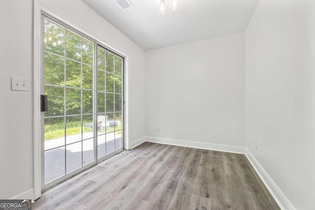 spare room with light hardwood / wood-style floors