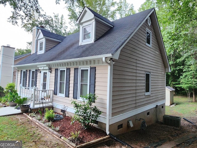 view of side of property featuring central AC unit