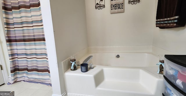 bathroom featuring a tub to relax in and tile patterned floors