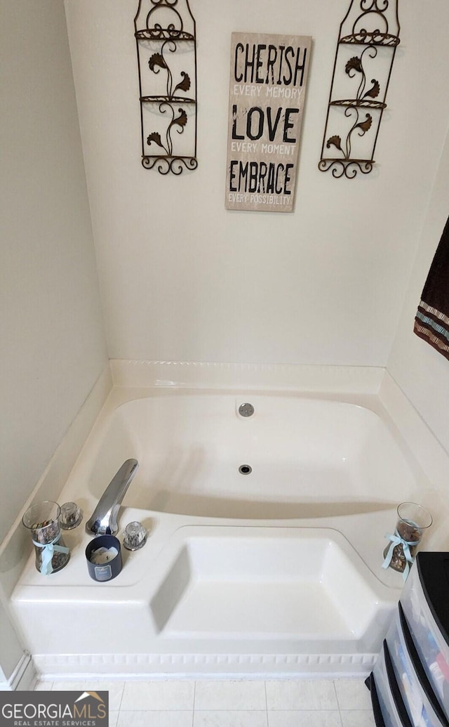 bathroom featuring a tub and tile patterned flooring