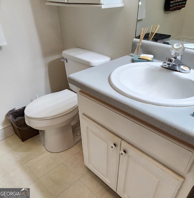 bathroom featuring vanity, toilet, and tile patterned floors