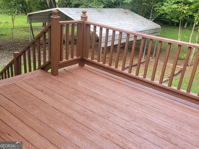 wooden terrace with a yard