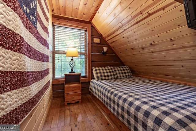 bedroom featuring wood walls, wooden ceiling, lofted ceiling, and hardwood / wood-style floors