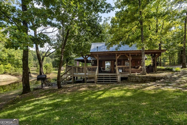 exterior space featuring a yard and a wooden deck