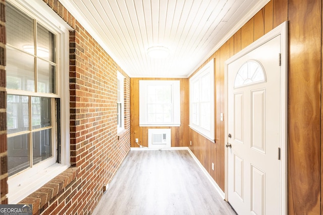 unfurnished sunroom featuring wooden ceiling