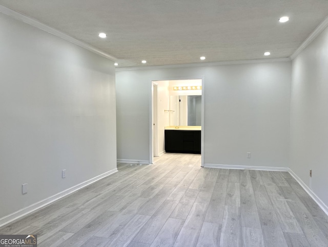 unfurnished room with ornamental molding, light wood-type flooring, baseboards, and recessed lighting