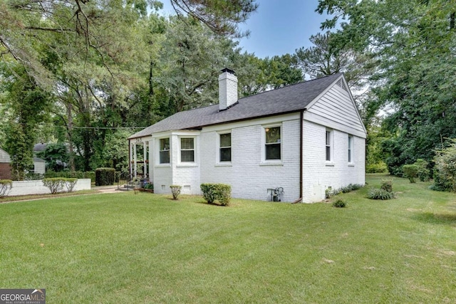 view of home's exterior with a lawn