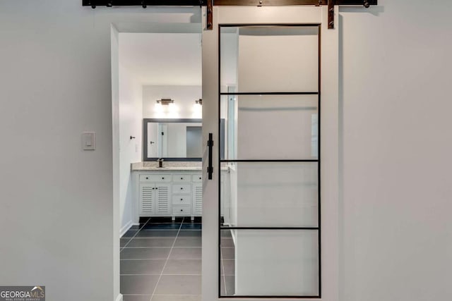 interior space featuring tile patterned flooring and vanity