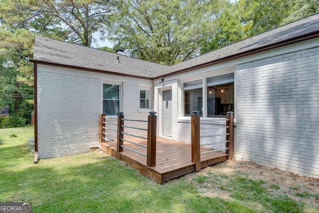 wooden deck with a lawn