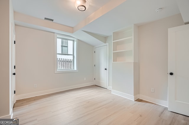 bonus room with light hardwood / wood-style floors