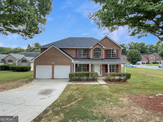 traditional-style home featuring a garage, brick siding, driveway, and a front lawn