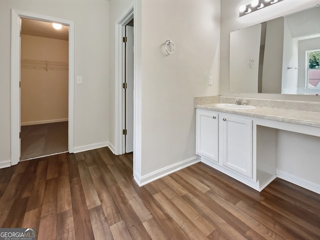 bathroom with hardwood / wood-style flooring and vanity