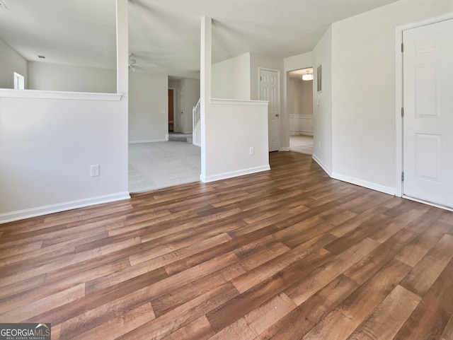 empty room with ceiling fan and hardwood / wood-style floors