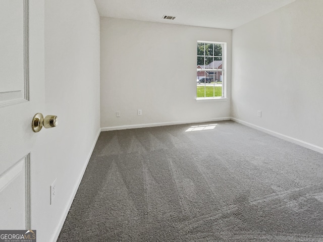 empty room featuring carpet flooring