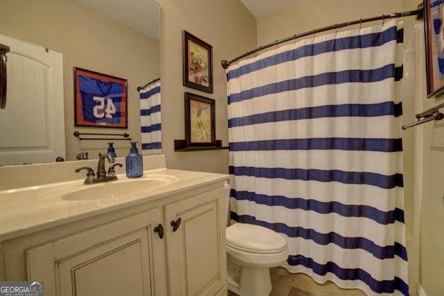 bathroom with vanity, a shower with curtain, and toilet